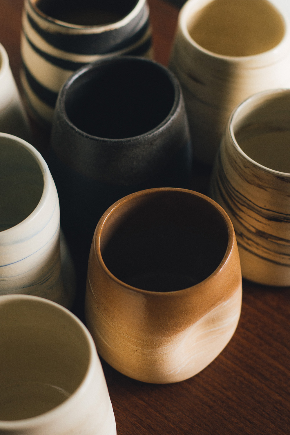 beautiful handmade ceramic cups in an assortment of colours