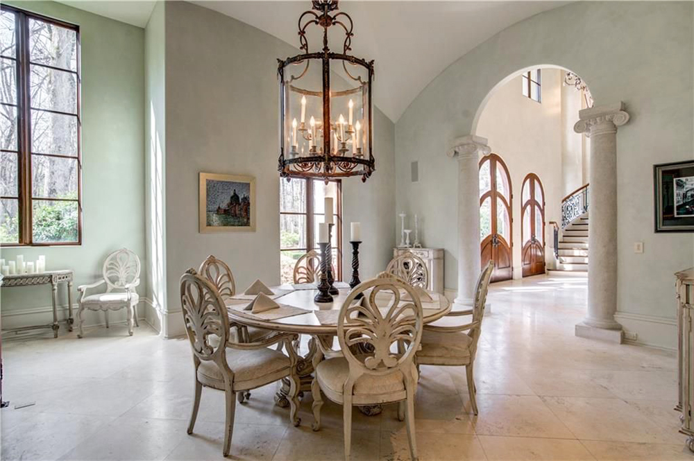 An over-sized dining room area off the main entrance featuring a small breakfast nook table