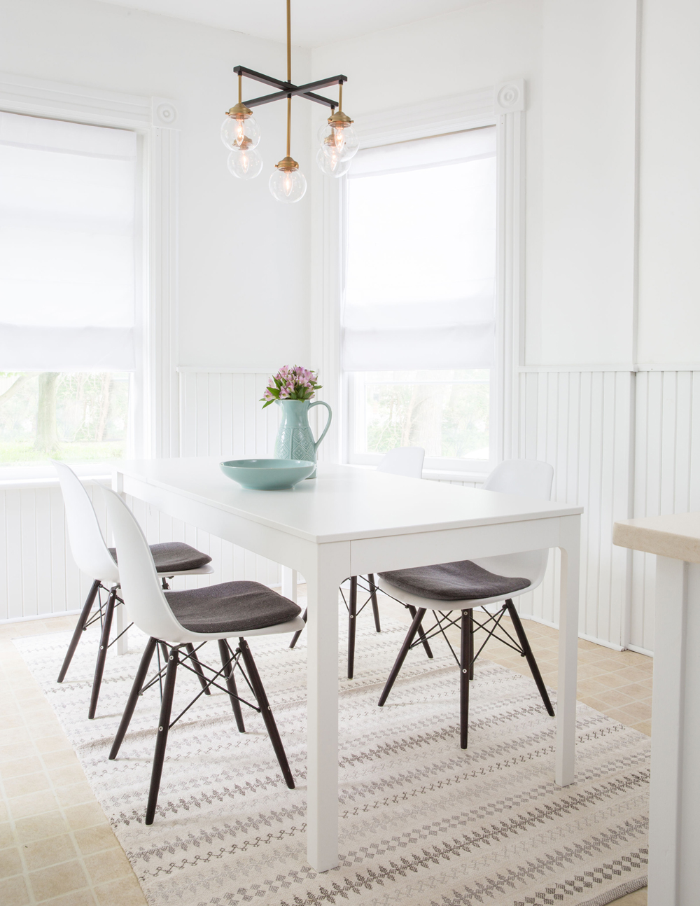 A bright and sunny white breakfast nook in the renovated kitchen