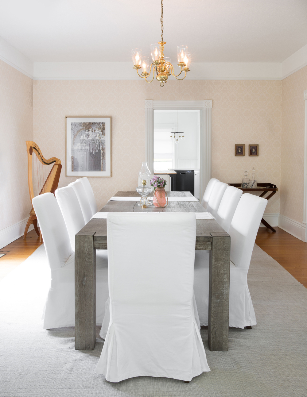 Large harvest table in the dining room that can seat 12 guests
