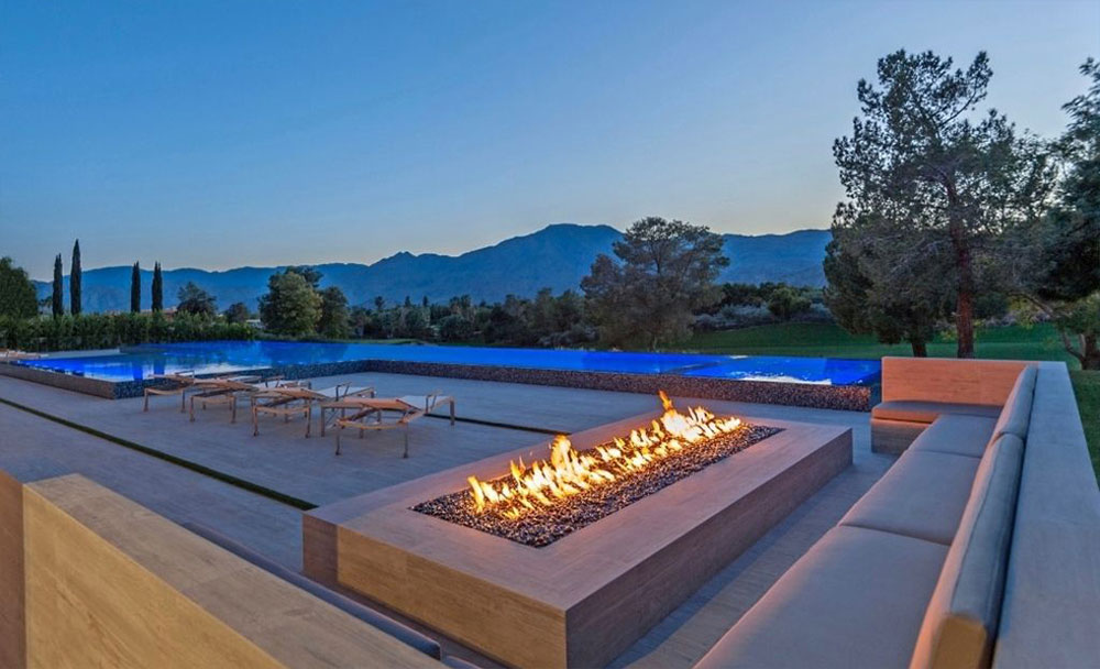A mirror-like infinity pool that overlooks a mountain range in the heart of California's Coachella Valley