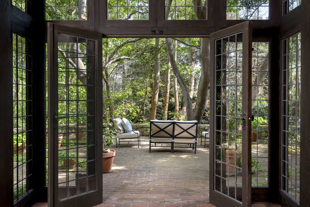 French doors open to the outdoor courtyard, offering a sense of the English countryside in California