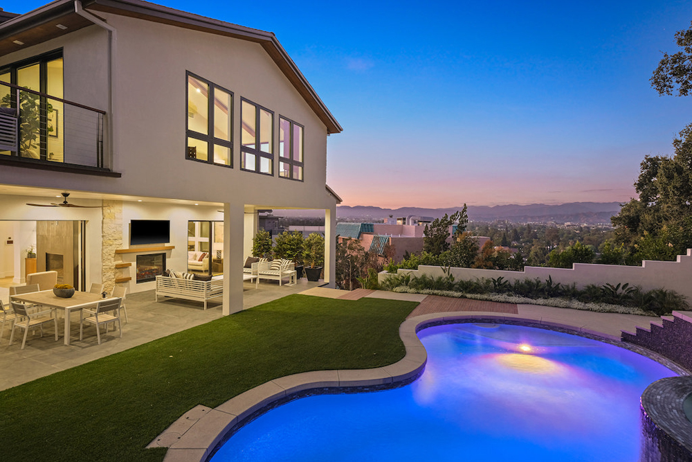 A backyard pool that offers both privacy and panoramic views of the city and mountains