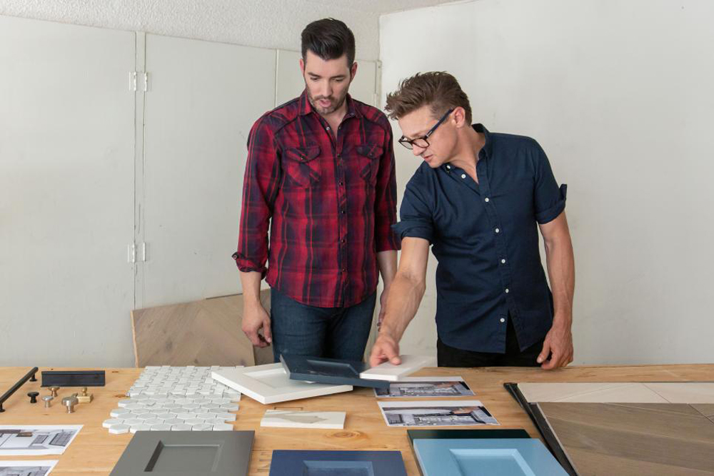 Jeremy Renner reviews the renovation plans with Jonathan Scott
