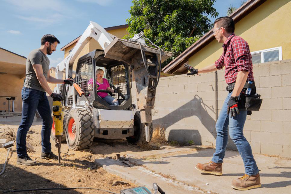 Rebel Wilson struggles to operate the excavator with the Property Brothers