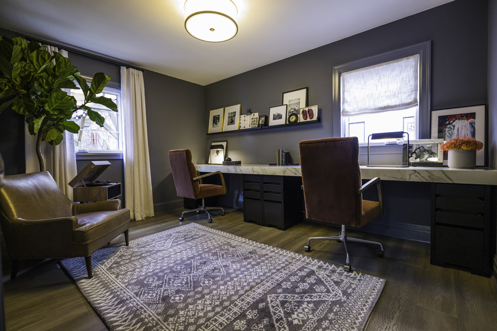 Blue paint with charcoal undertones sets the tone of this relaxing home office space