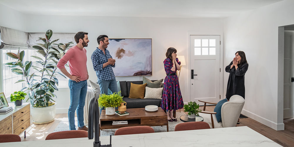 Drew and Jonathan Scott look on as Sarah and Zooey Deschanel marvel at the renovation