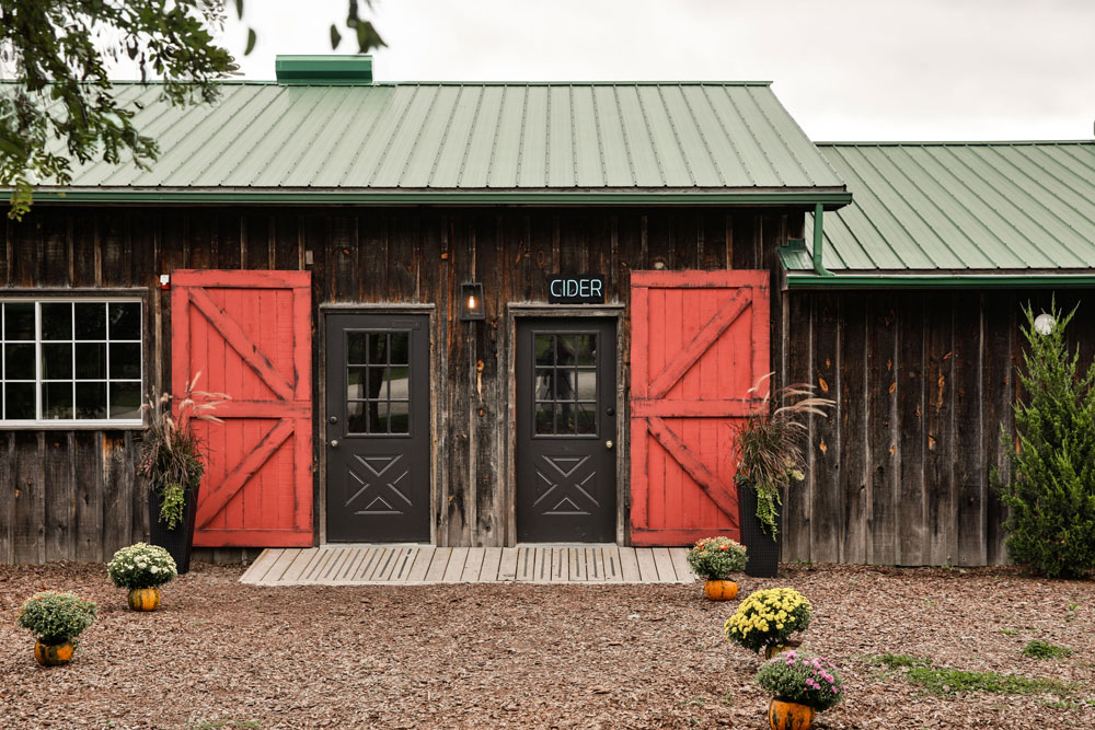 cider barn with two red doors