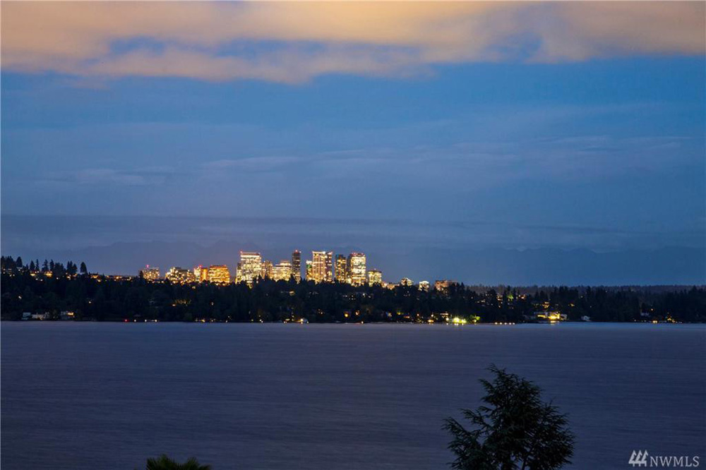 Skyline of Seattle as seen from the backyard windows the Queen Anne mansion at nightfall