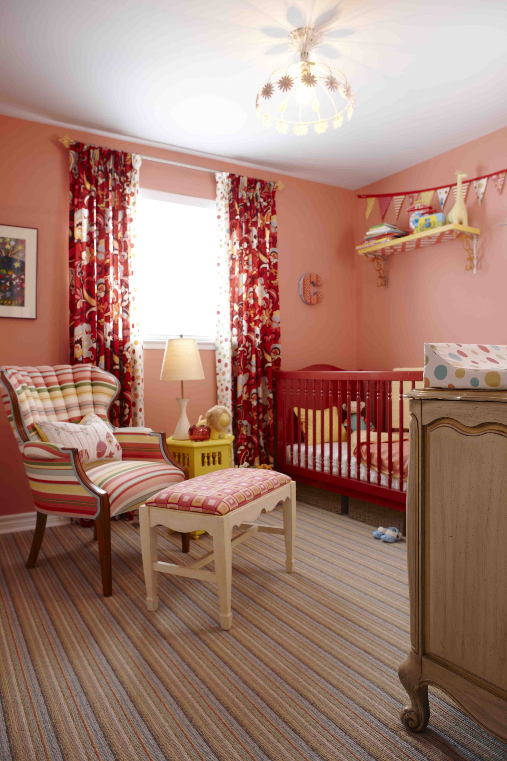 Bold red nursery room designed by Sarah Richardson.