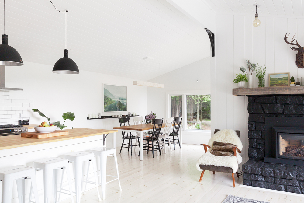 A bright white open-concept kitchen and dining area