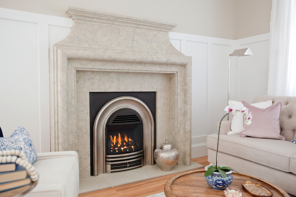 contemporary white living room with Valor Portrait Classic Arch shown with Coals and Fluted Black Liner
