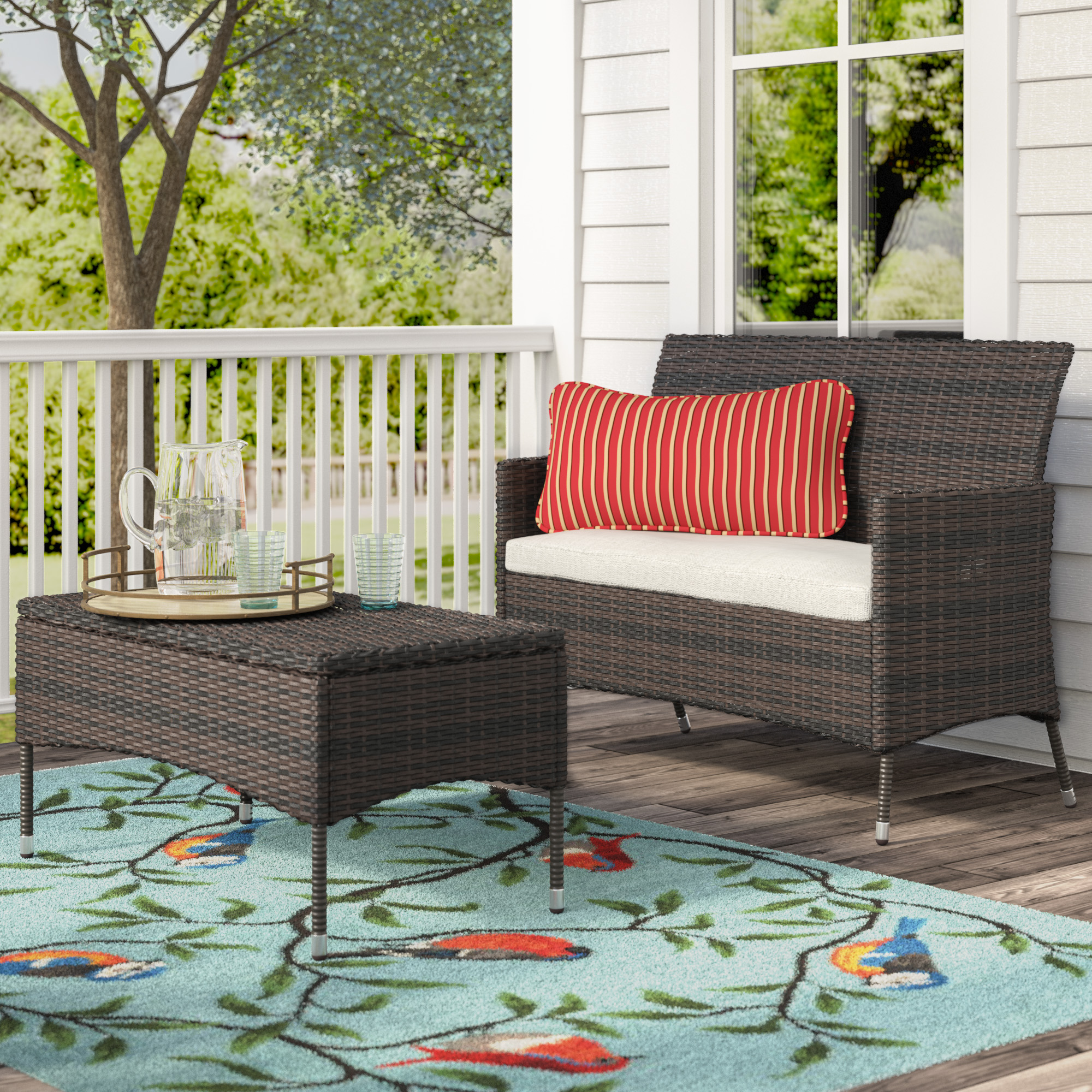 Outdoor rug on porch with rattan furniture