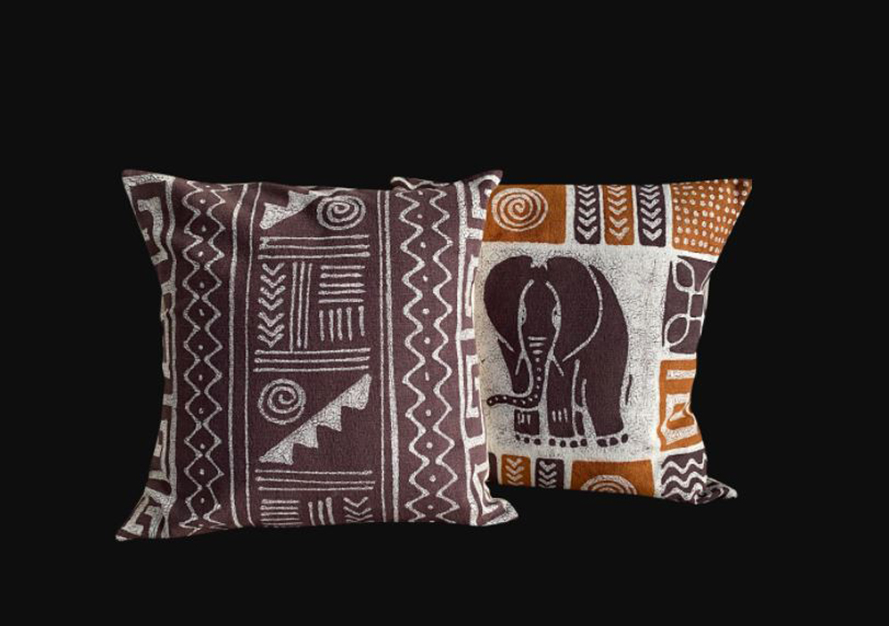 Geometric and Elephant Mix and Match Pillows against a black background