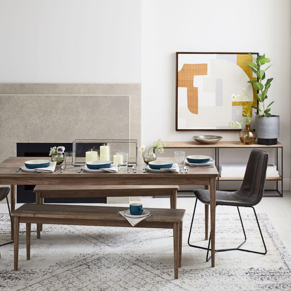 modern dining room with textured abstract wall art on wall