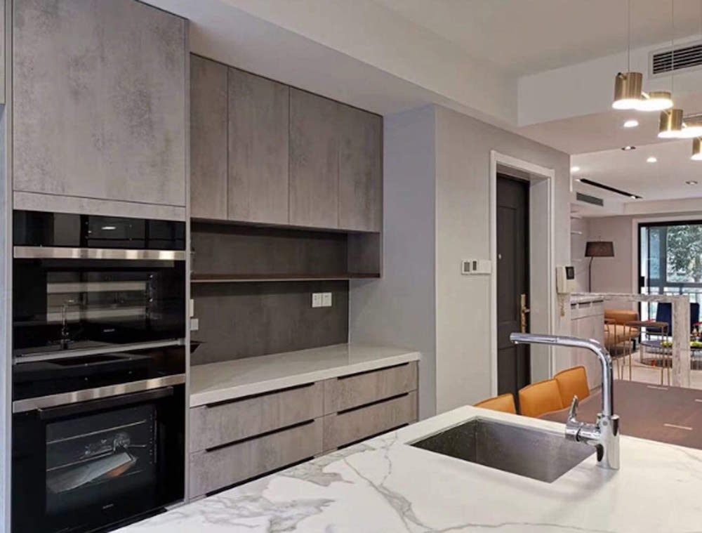 minimalist kitchen with tab-edge hardware on brown cabinets