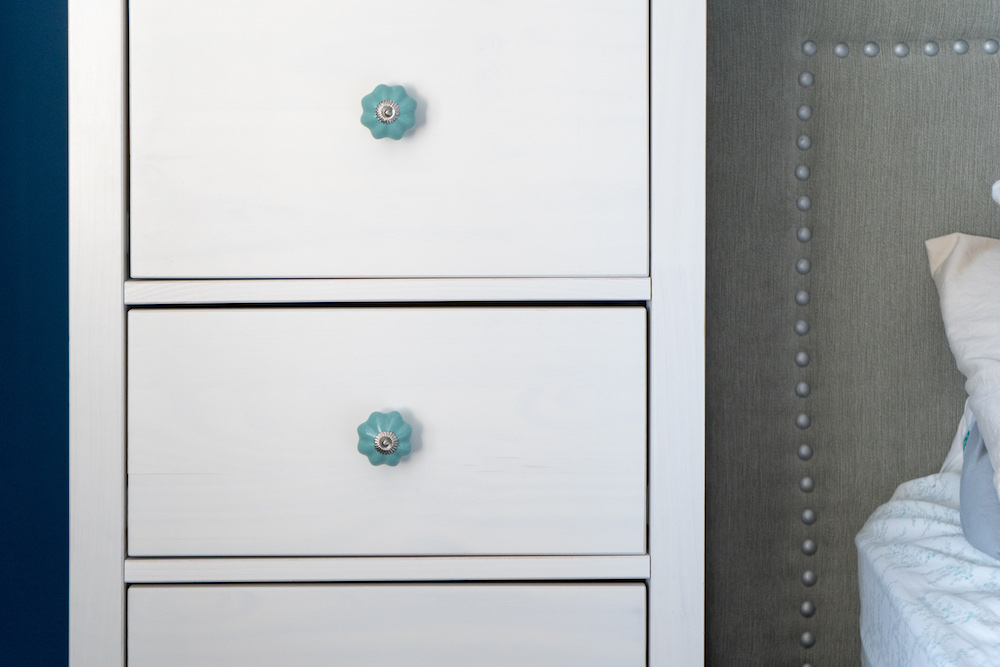 White dresser with custom turquoise drawer pulls