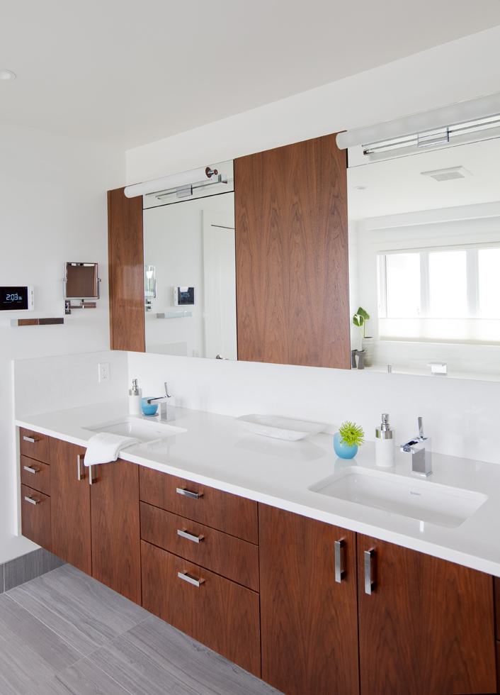 A master ensuite with flat-sawn walnut cabinetry.