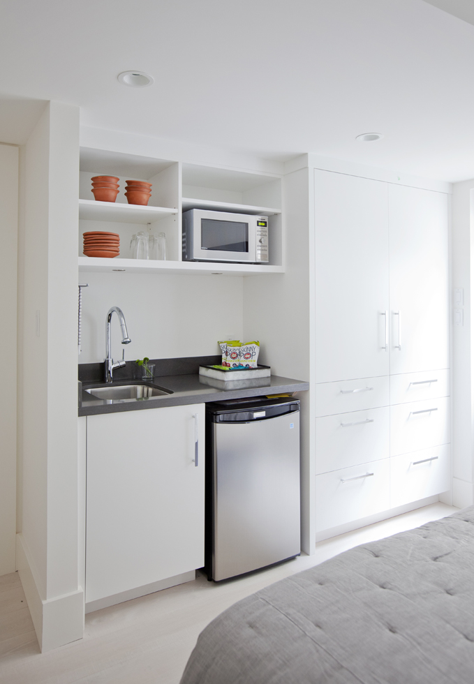 A guest room with a small kitchenette