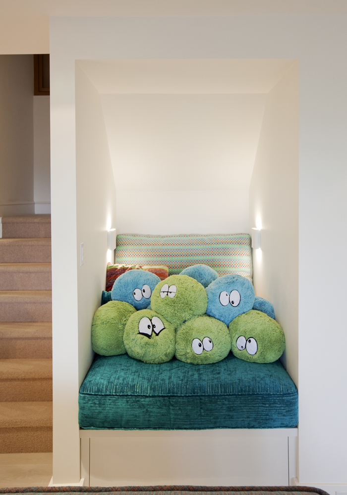 A plush reading nook with playful cushions.