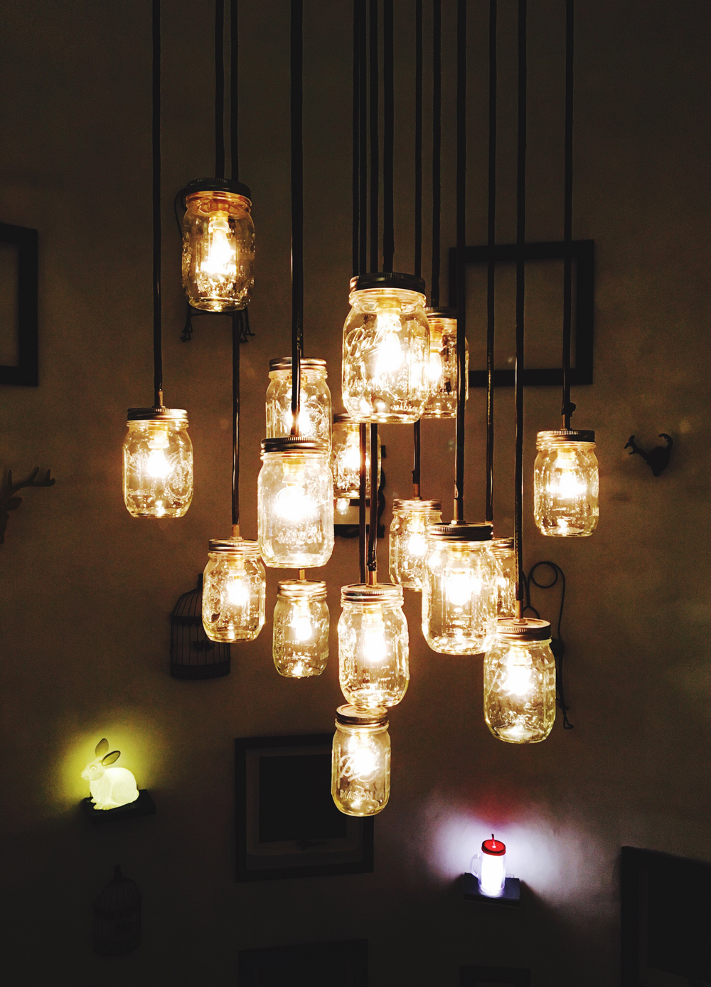 Mason jar lights hanging from a ceiling