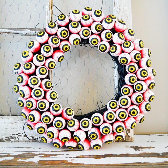 A Halloween wreath made entirely of fake eyeballs