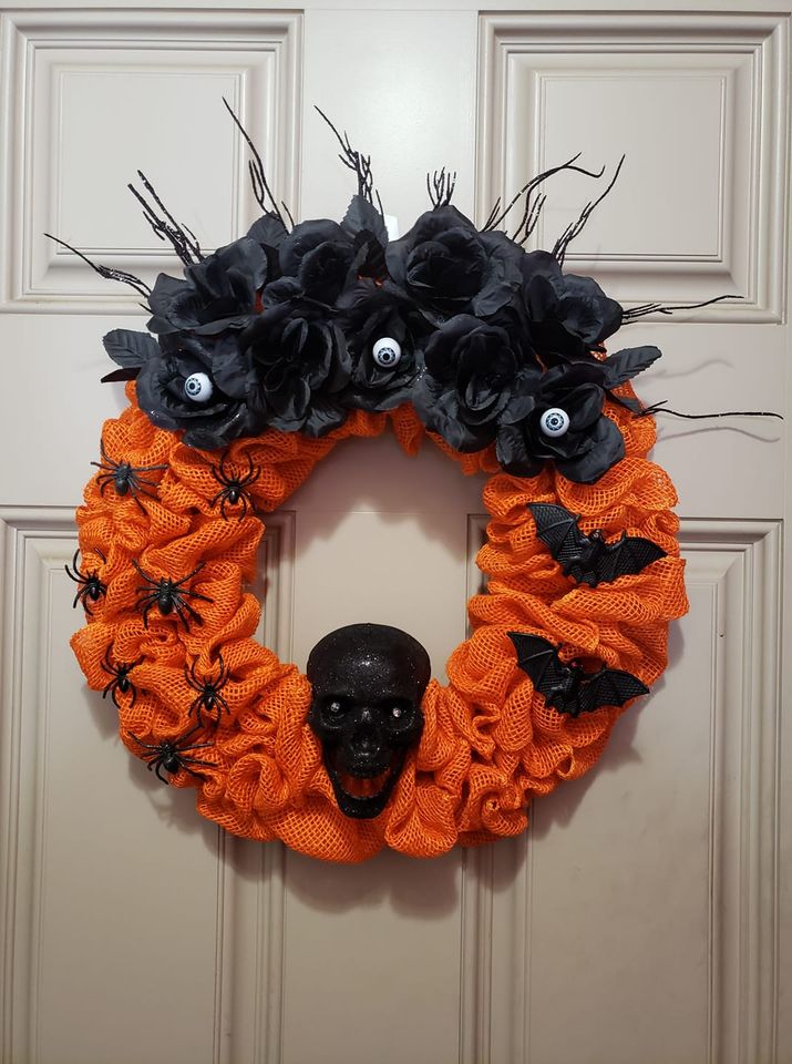 Black and orange Halloween wreath with skull and bats