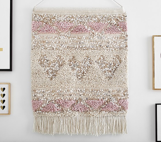woven heart tapestry on wall