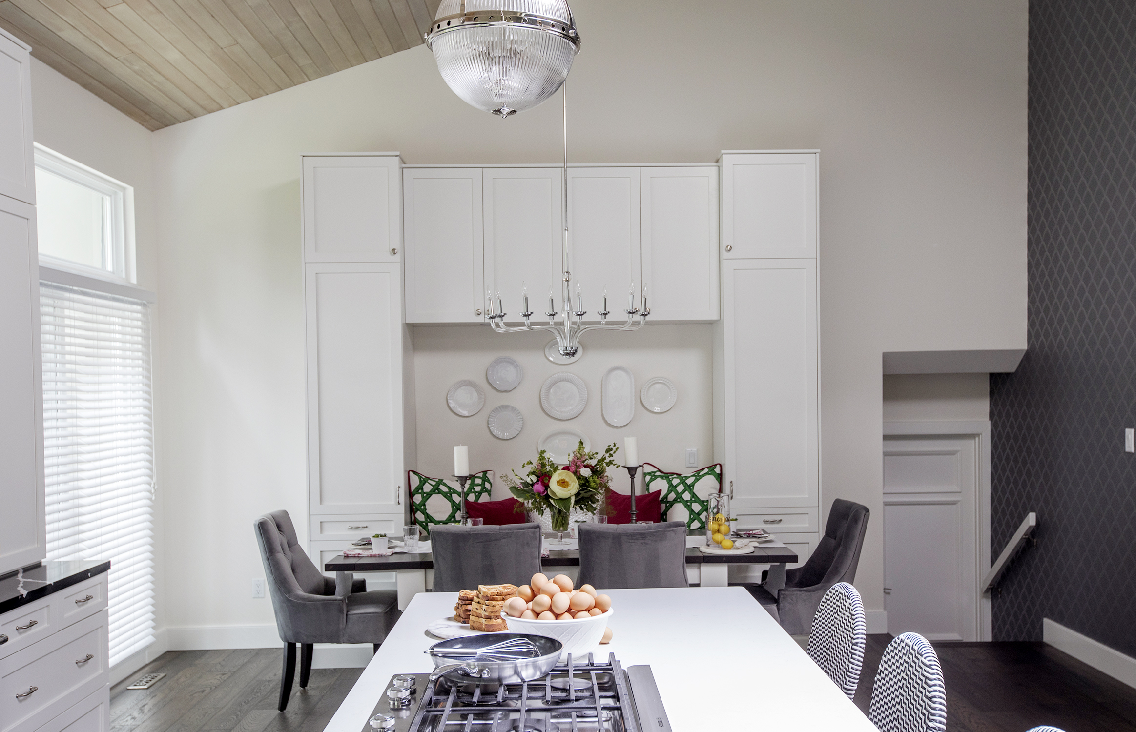 Modern white kitchen with built-in banquette