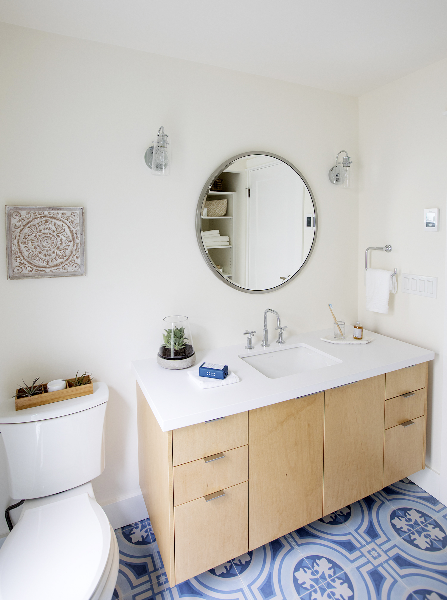 A floating vanity makes the room feel more open and offers plenty of storage options.