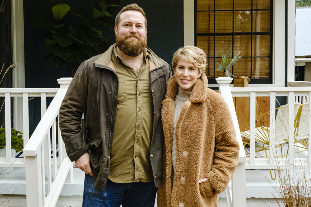 Ben and Erin Napier from HGTV's Home Town standing in front of a renovated house