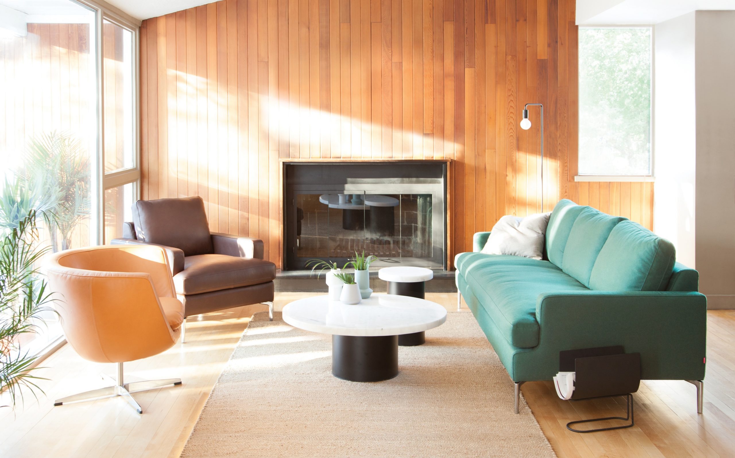 Modern living room featuring green, orange and brown furniture.