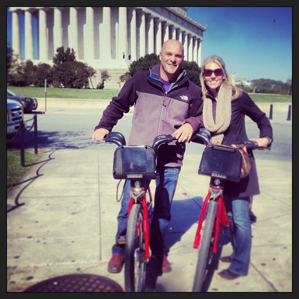 Bryan and Sarah Baeumler biking together.