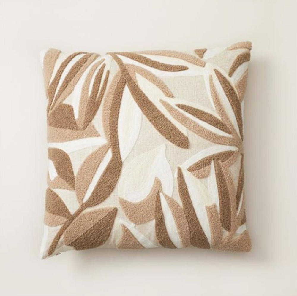 Embroidered pillow cover featuring falling leaves