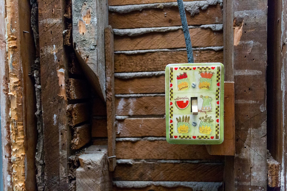 A light switch in a home that is under renovation