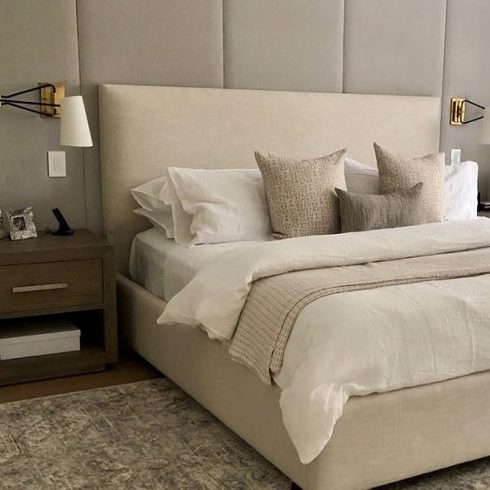 beige platform bed in cozy bedroom
