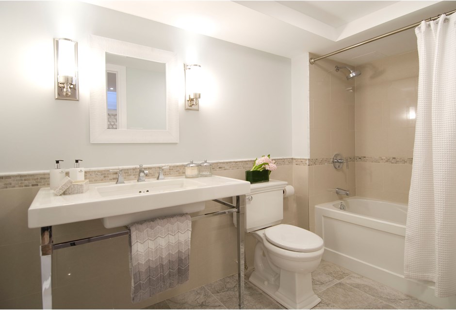 Renovated basement bathroom in neutral colours