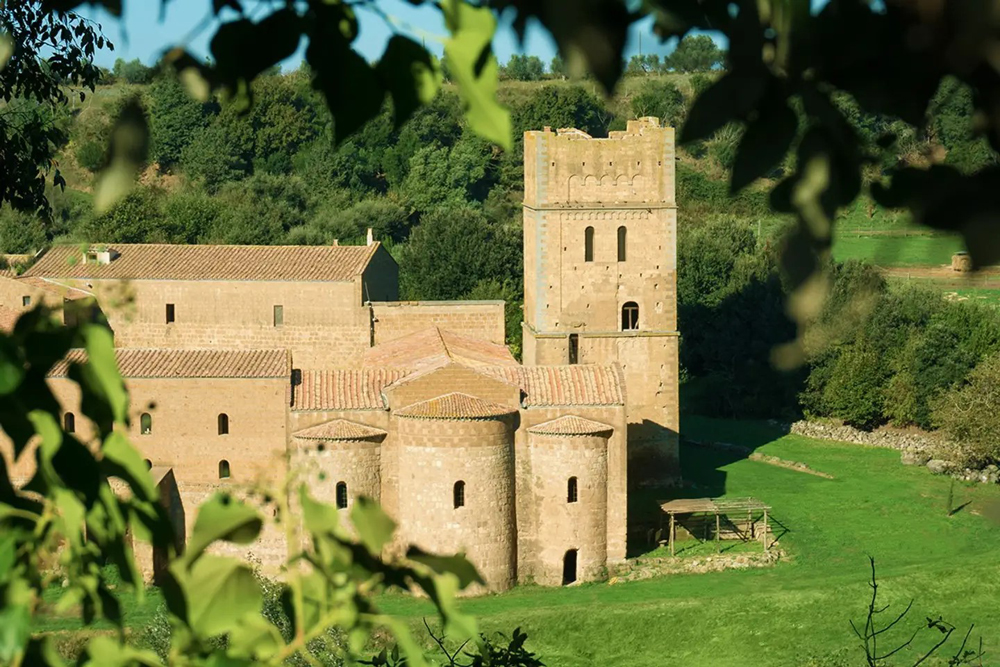 A medieval castle in Italy surrounded by lush greenery