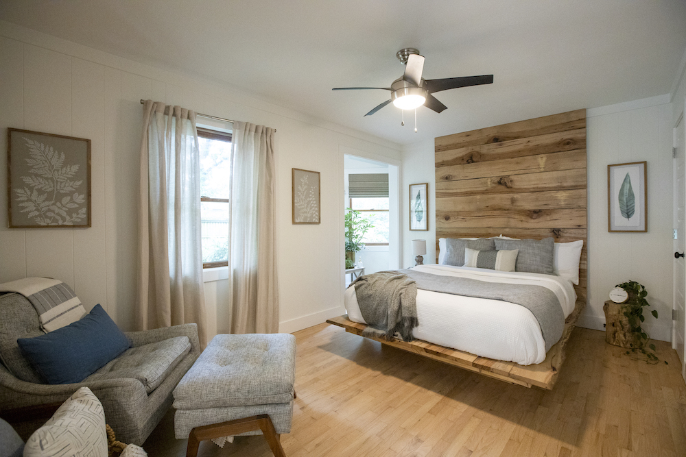cozy white bedroom with wood headboard