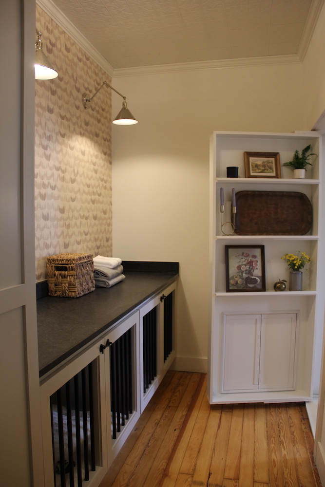 hidden laundry room with built-in dog area