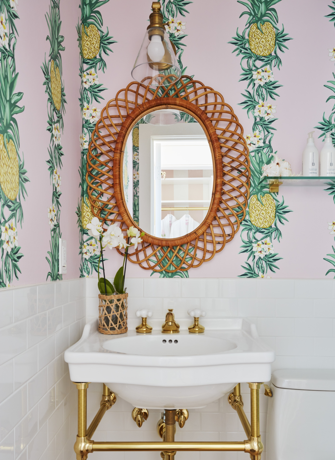 Pineapple and floral pink wallpaper in bathroom