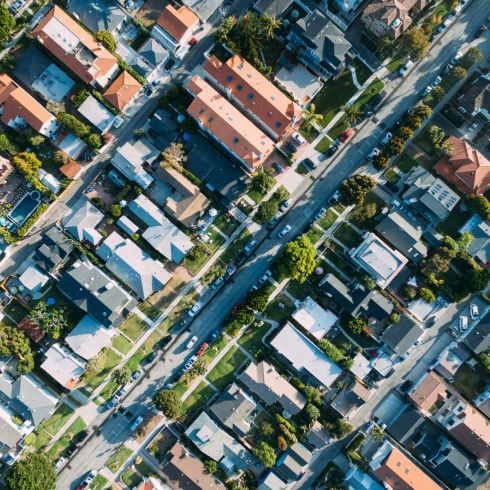 Aerial shot of neighbourhood homes and greenery