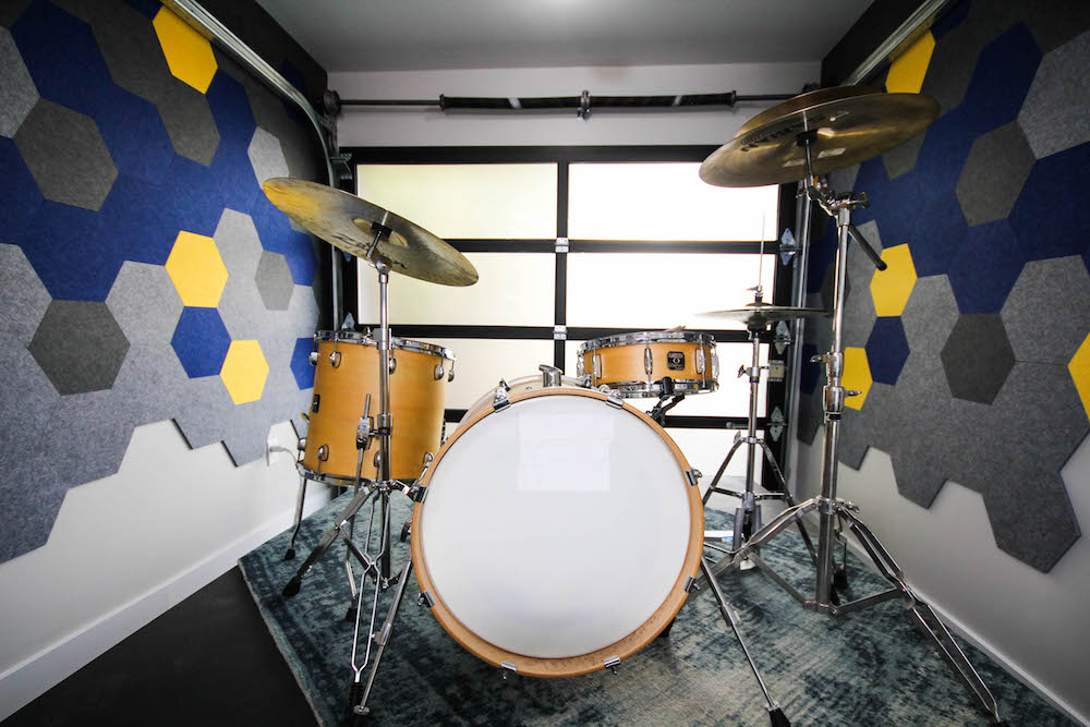 garage with geometric walls and drum set