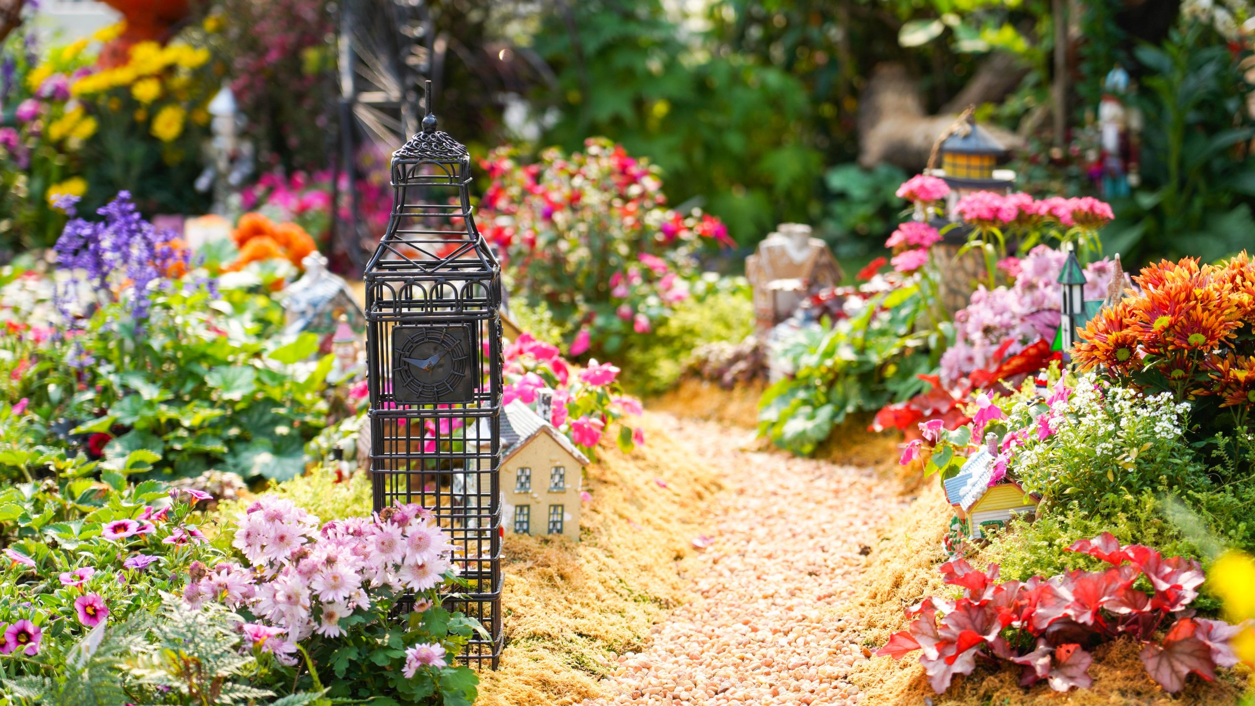 flower garden with whimsical figures at edges