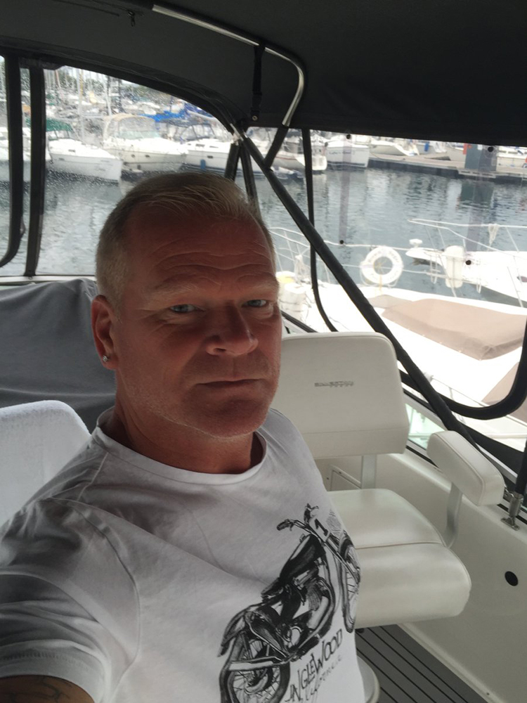 Mike Holmes takes a selfie on his boat