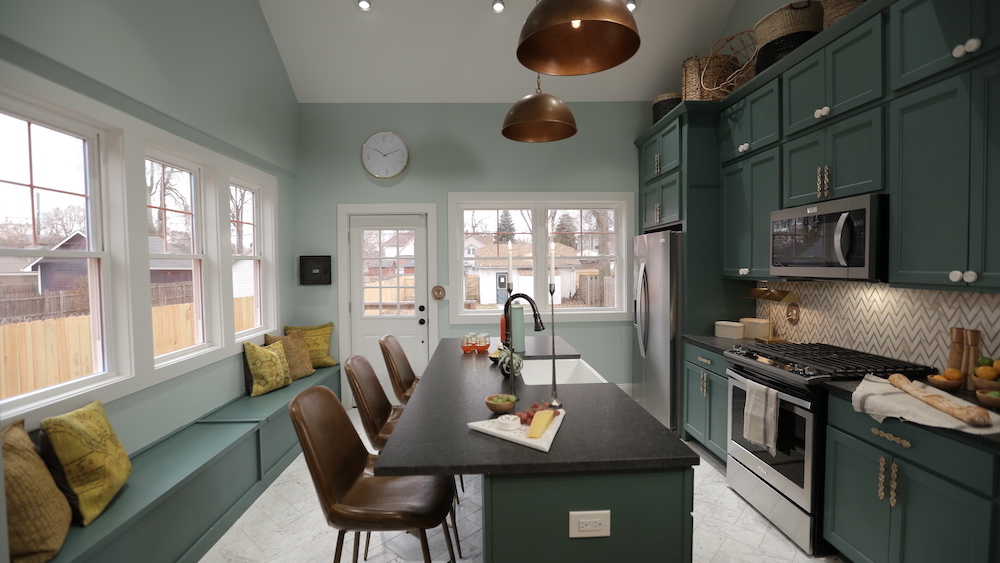 kitchen with green cabinets and light green walls