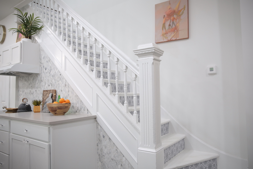 white staircase with printed stairs