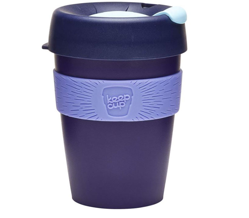 A bright purple reusable coffee tumbler