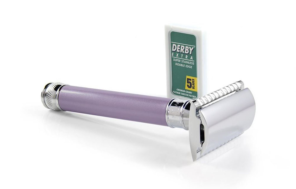 A purple-handled stainless steel women's razor blade with extra razors