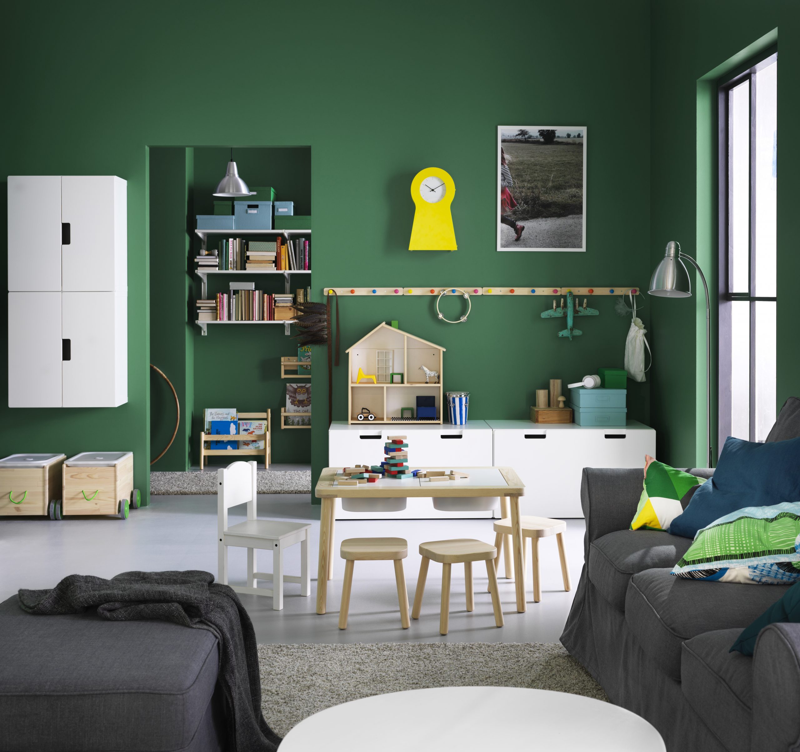 Kid-friendly deep green living room with IKEA furniture